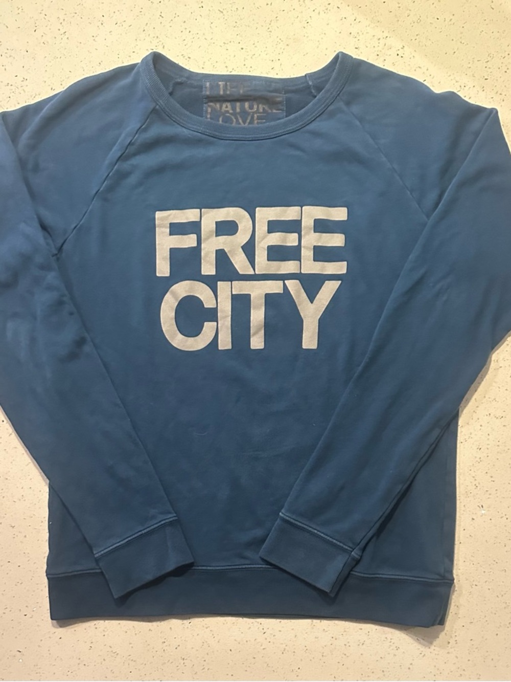 Freecity / unisex Blue Crewneck Sweatshirt with text on front and back, EUC